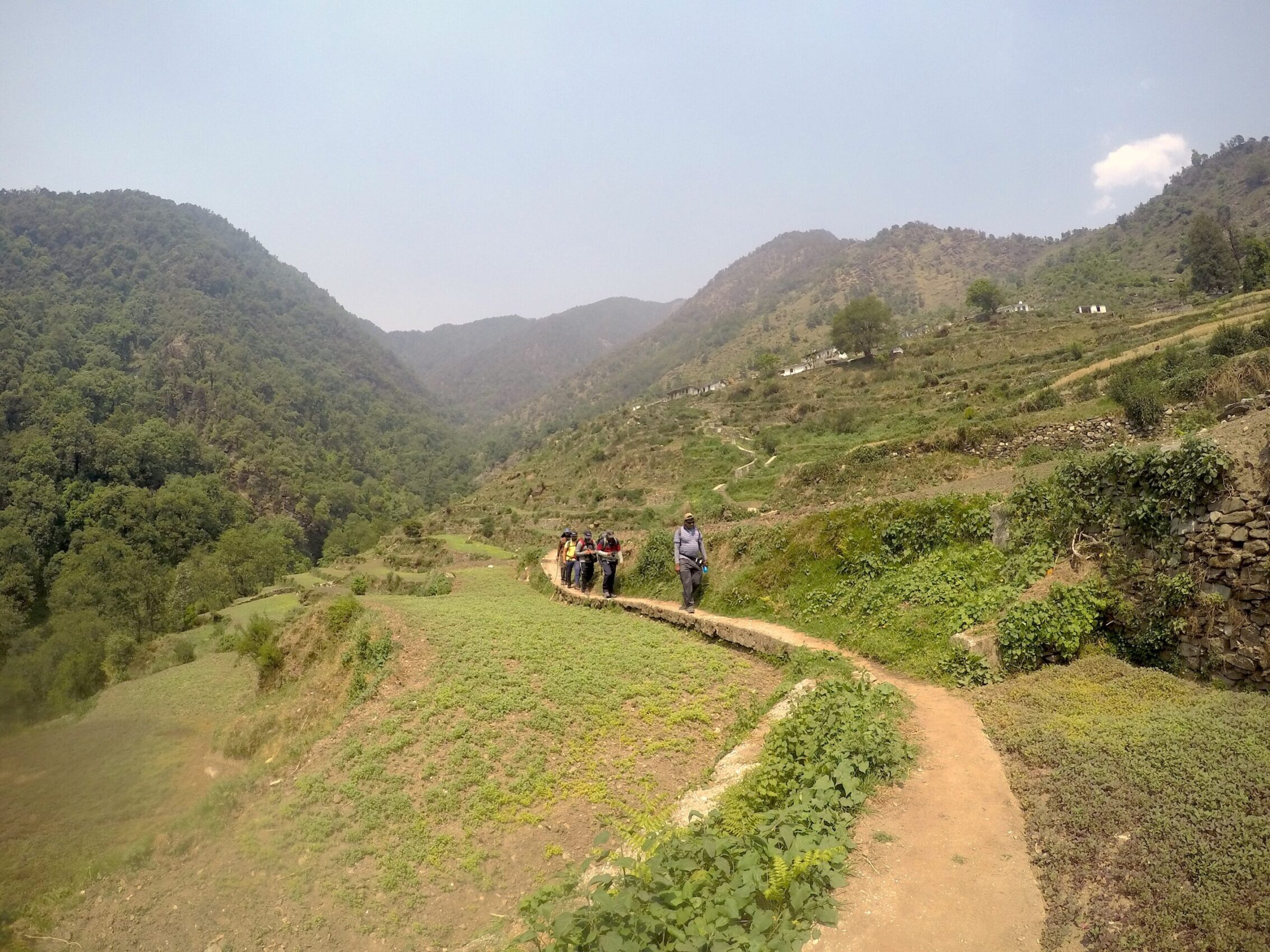 People walking amid the Himalayan rice terraces